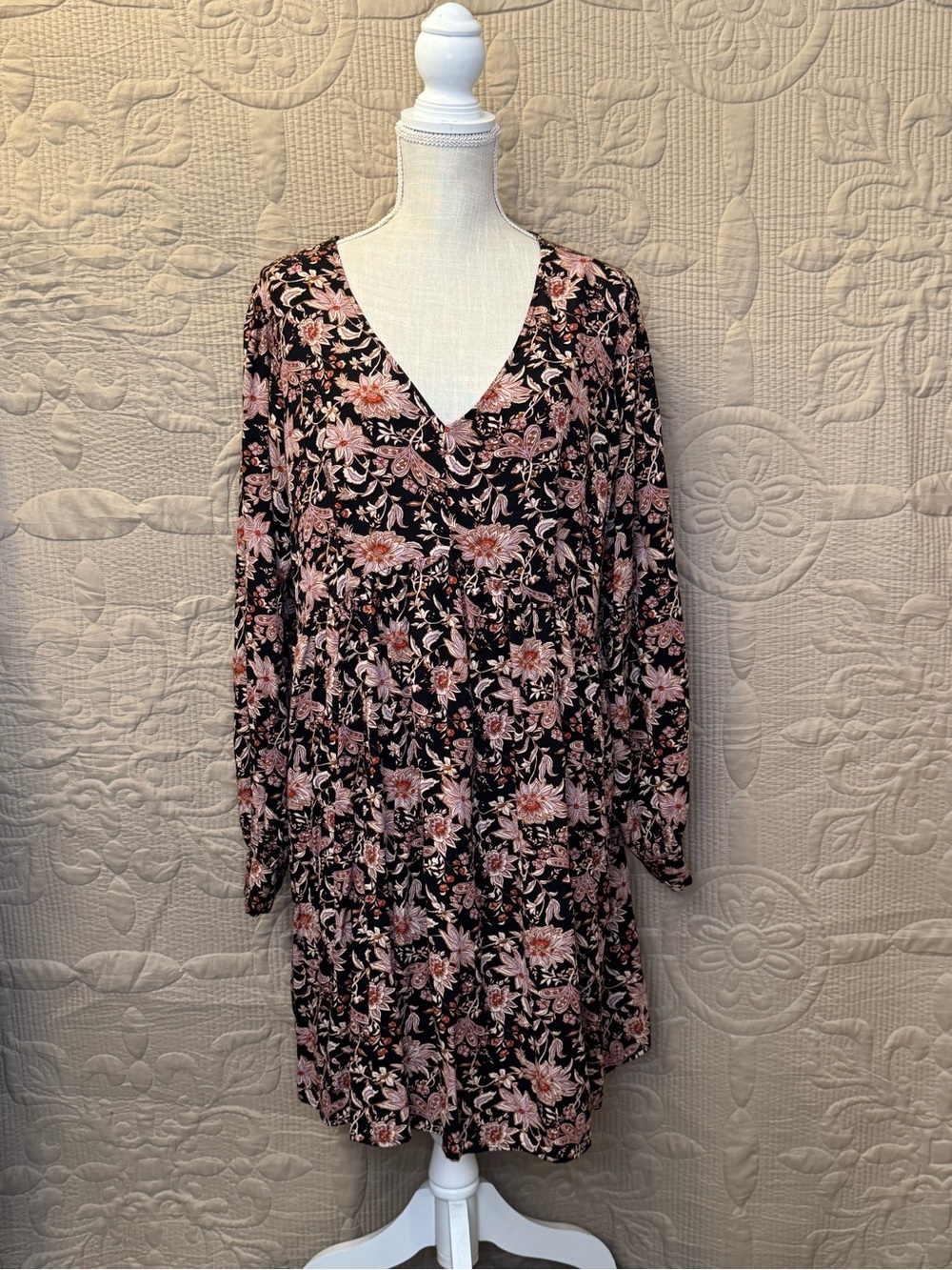 Knox Rose Tunic Dress. Black Background with a Pink and cream floral Pattern